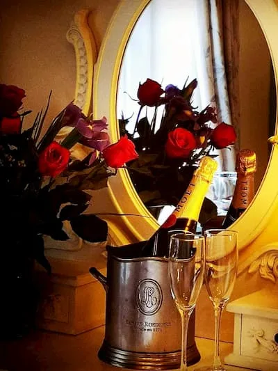 Celebrate in style - A bottle of champagne on ice with roses